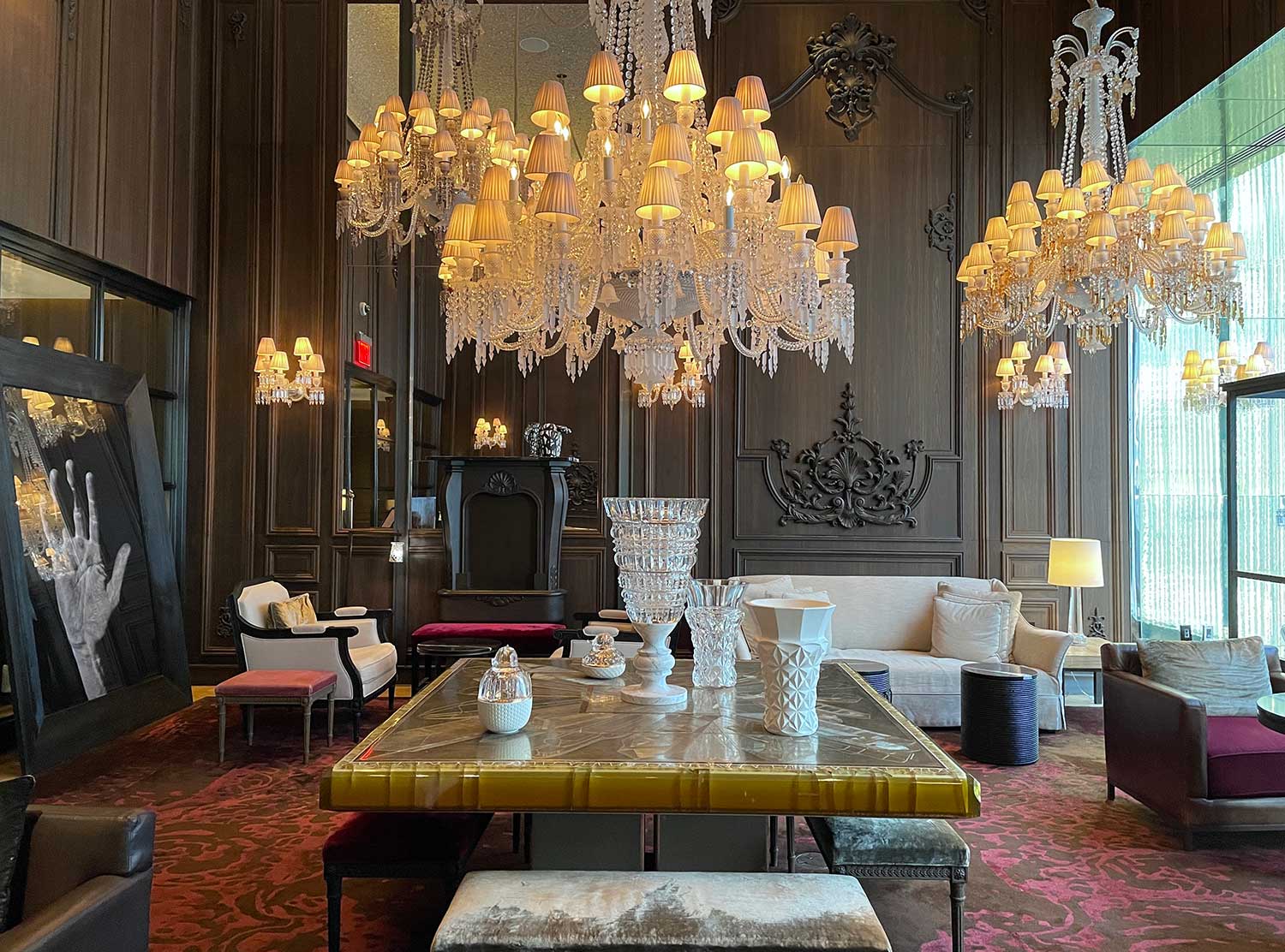 Baccarat Hotel Only a few of the incredible 17 custom crystal chandeliers housed in the space.